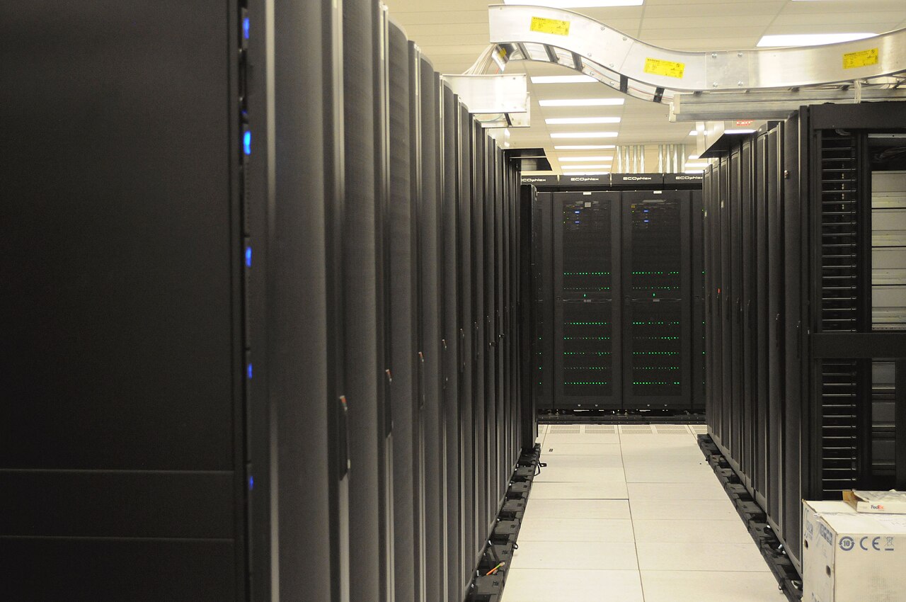 Rows of server racks in a data center hall