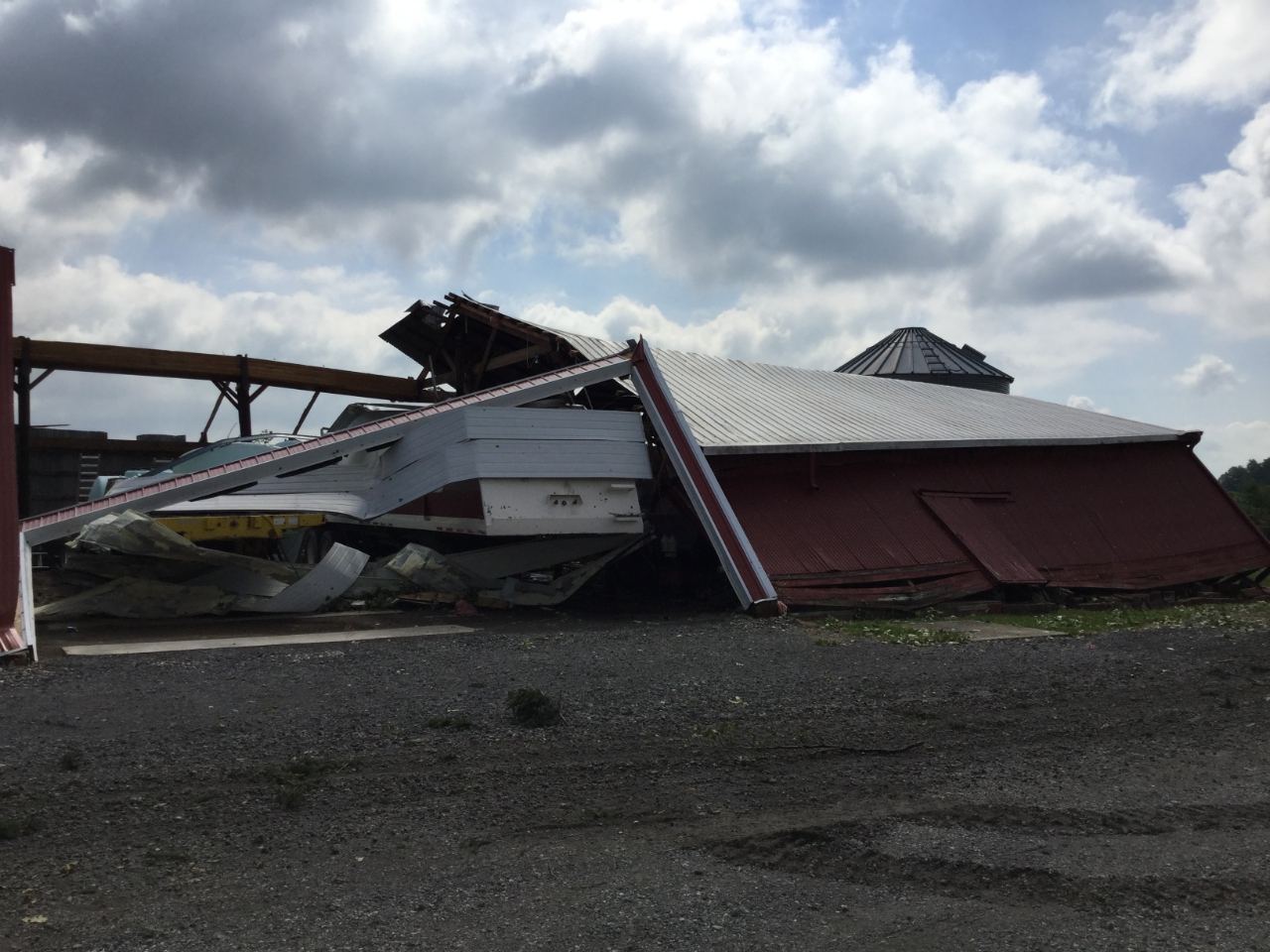 Storm-damaged farm buildings and debris in northern Indiana